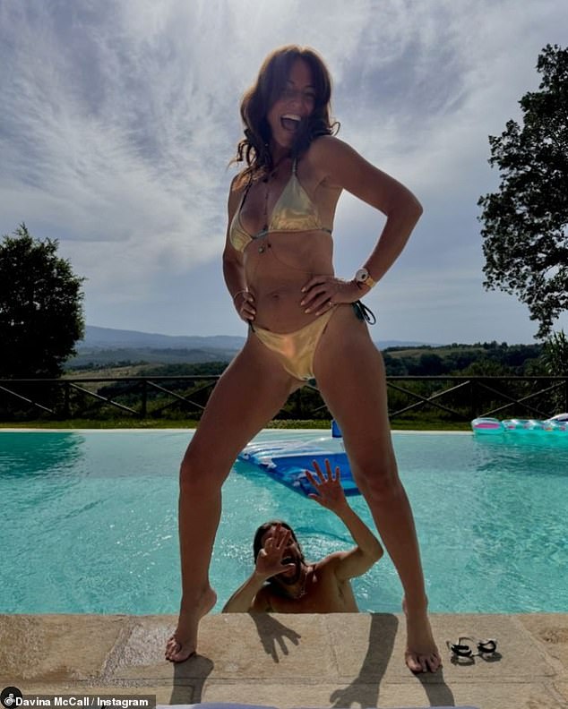 Davina McCall, 56, shows off her toned physique in a skimpy gold bikini as she poses by the pool during trip to Italy with her boyfriend Michael Douglas