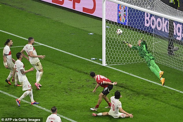 Turkey keeper Mert Gunok pulls off ‘Gordon Banks-esque’ save in 94th minute to help his nation dramatically reach quarter-final of Euro 2024 after 2-1 victory over Austria