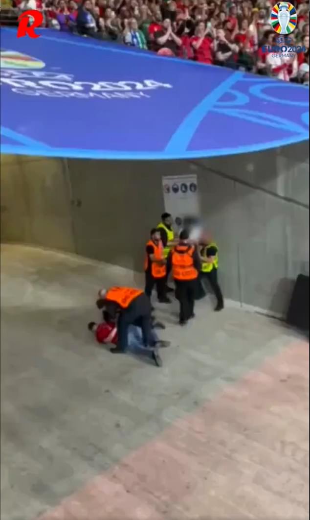 A viral video shows a fan being attacked by a group of stewards at Euro 2024 on Monday