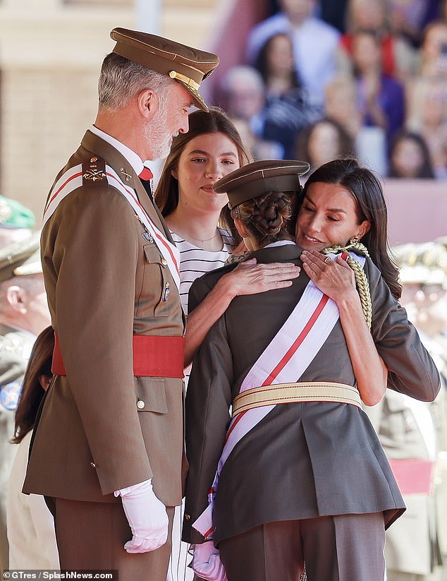 Queen Letizia, who was dressed in an elegant white floral dress, was also seen giving her daughter a warm hug