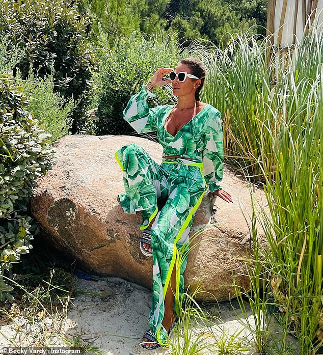 Rebekah Vardy looks incredible in a plunging green two-piece as she does the splits mid-air while ‘living the wild life’ on holiday in Portugal