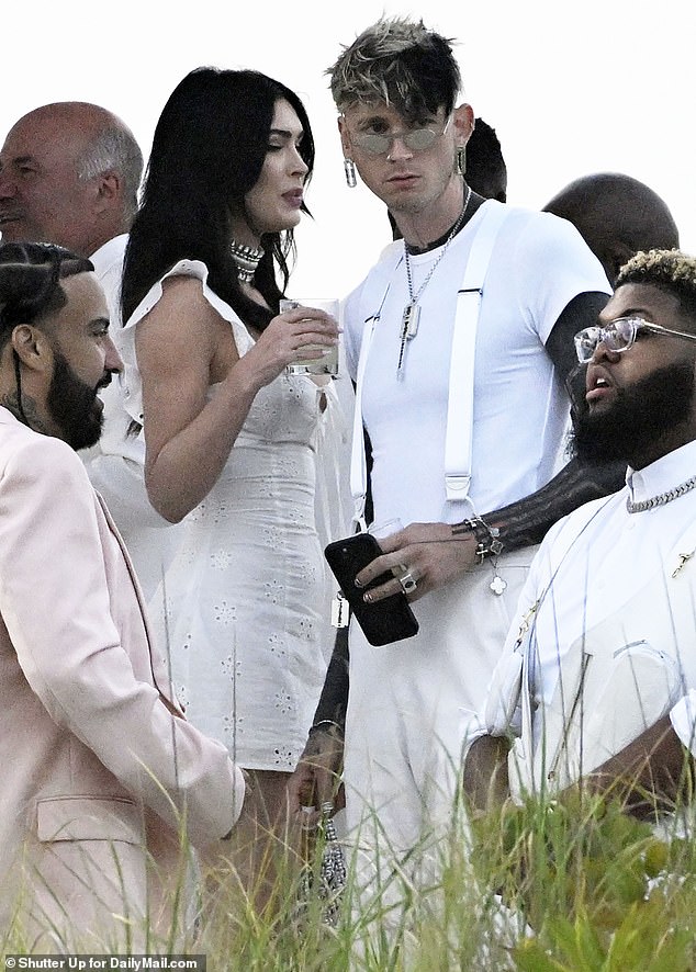 Megan Fox and Machine Gun Kelly swap goth glam for summer chic as they put on united front at Michael Rubin’s white party… months after they called off engagement