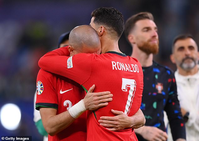 Cristiano Ronaldo consoles an emotional Pepe after Portugal’s Euro 2024 defeat by France as the veterans bow out of the competition with loss on penalties