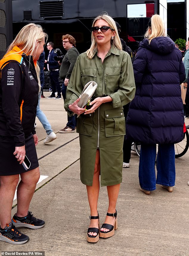 Mollie, 37, looked as stylish as ever in a leather khaki dress which she teamed with wedges and a white clutch bag
