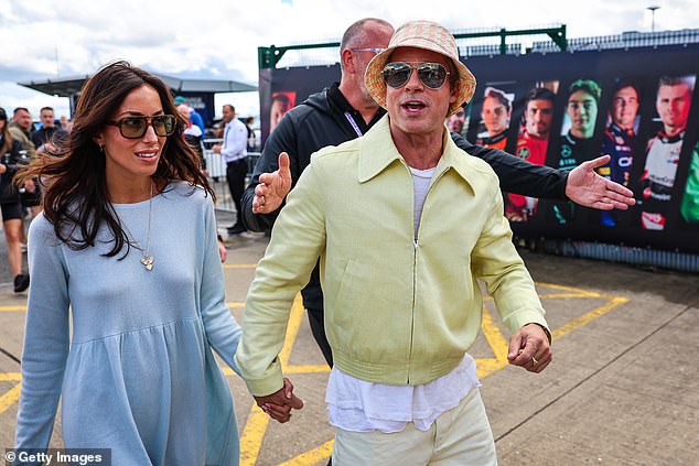 Brad Pitt, 60, and his girlfriend Ines de Ramon, 34, add a touch A-list glamour to rainy final day of British Grand Prix as they join Geri Horner, Mollie King and Gordon Ramsay at Silverstone