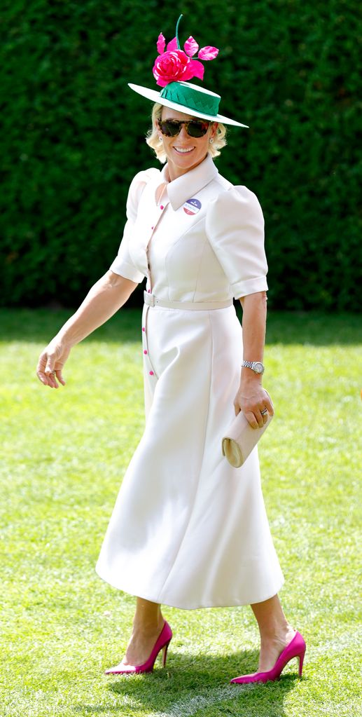     Zara Tindall wears white dress with pink buttons and heels as she attends 'Ladies Day' on day three of Royal Ascot at Ascot Racecourse on June 16, 2022 in Ascot, England
