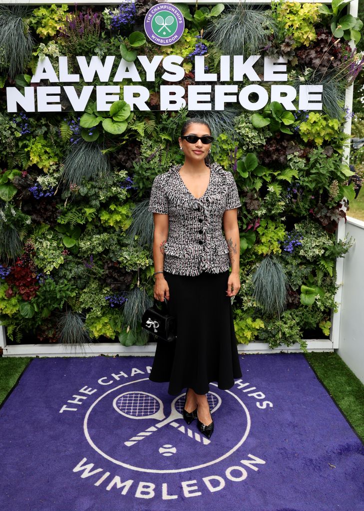 Vanessa White in a skirt and jacket at Wimbledon