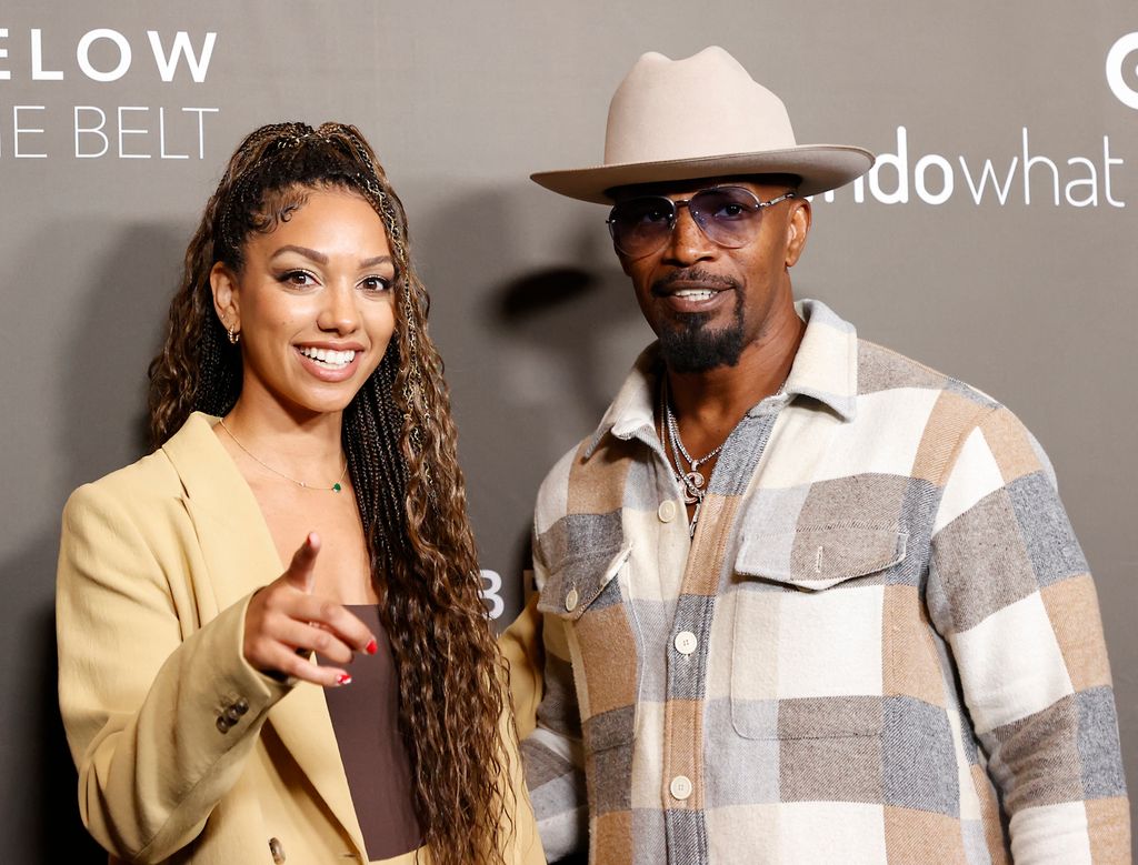American actor Jamie Foxx (right) and his daughter American producer Corinne Foxx arrive for the film's premiere in Los Angeles. "below the belt" At the Directors Guild of America in Los Angeles, October 1, 2022. (Photo by MICHAEL TRAN/AFP) (Photo by MICHAEL TRAN/AFP via Getty Images)