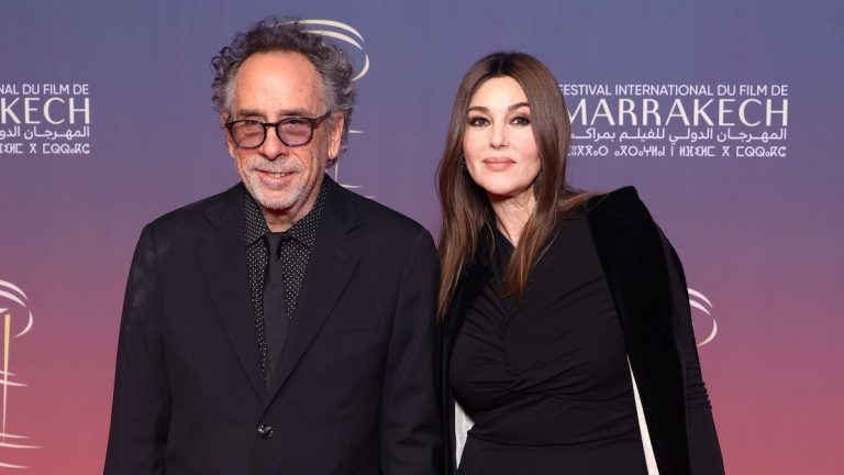 Monica Bellucci, with Tim Burton, wins the Marrakech Film Festival in a draped dress and velvet cape