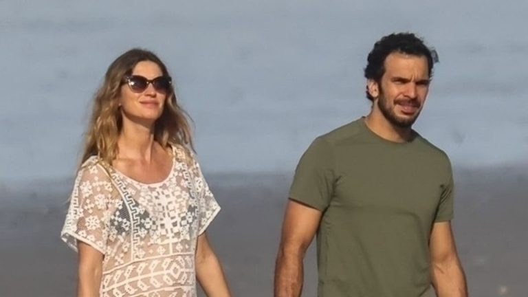 Gisele Bundchen shows off her growing baby bump while on vacation with boyfriend Joachim Valente