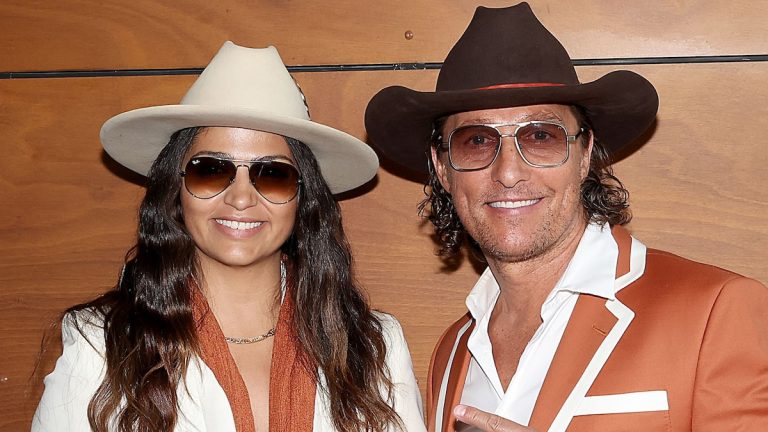 Matthew McConaughey and Camila Alves wear original cowboy hats for the Texas Longhorns